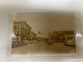 1940s RPPC Postcard showing Street Scene with Autos in Baker Oregon 